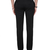 Close-up of Alexander McQueen pants hardware and fine stitching