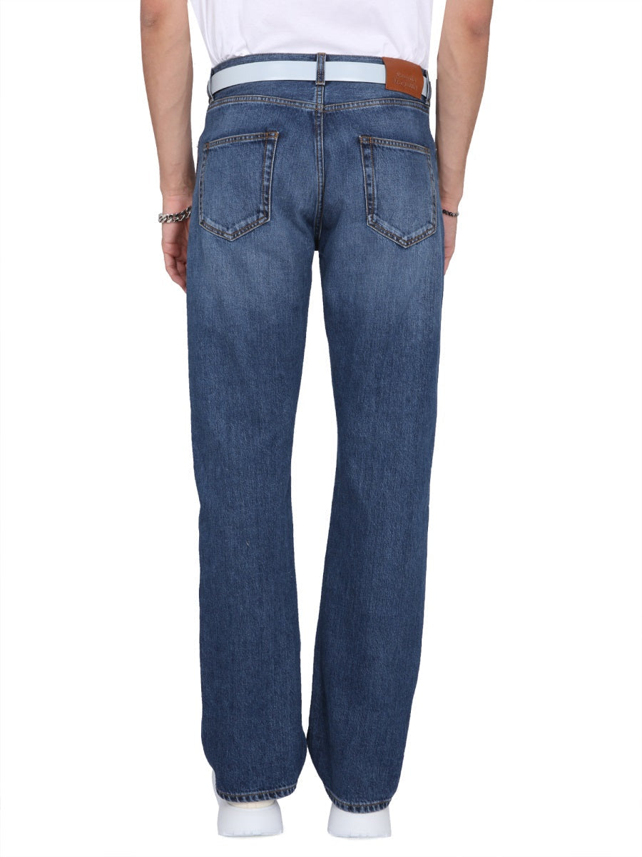 Close-up of Alexander McQueen pants hardware and fine stitching