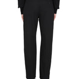 Close-up of Alexander McQueen pants hardware and fine stitching