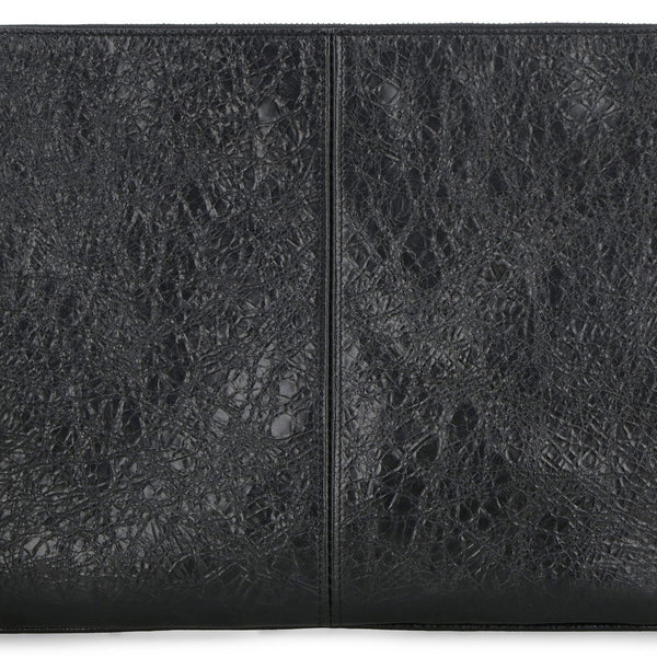 Close-up of Balenciaga pochettes hardware and fine stitching