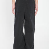 Close-up of Balenciaga pants hardware and fine stitching