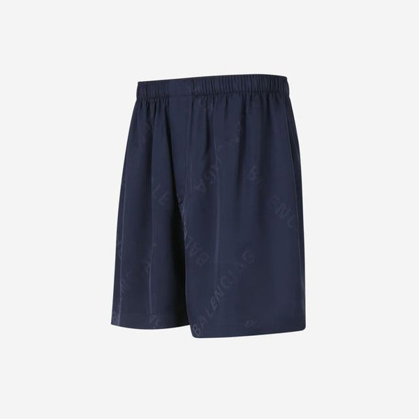 Close-up of Balenciaga pants hardware and fine stitching