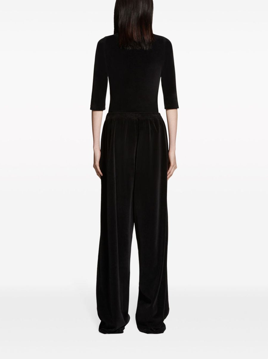 Close-up of Balenciaga pants hardware and fine stitching