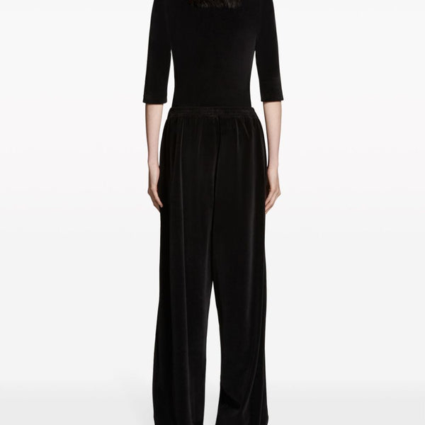 Close-up of Balenciaga pants hardware and fine stitching