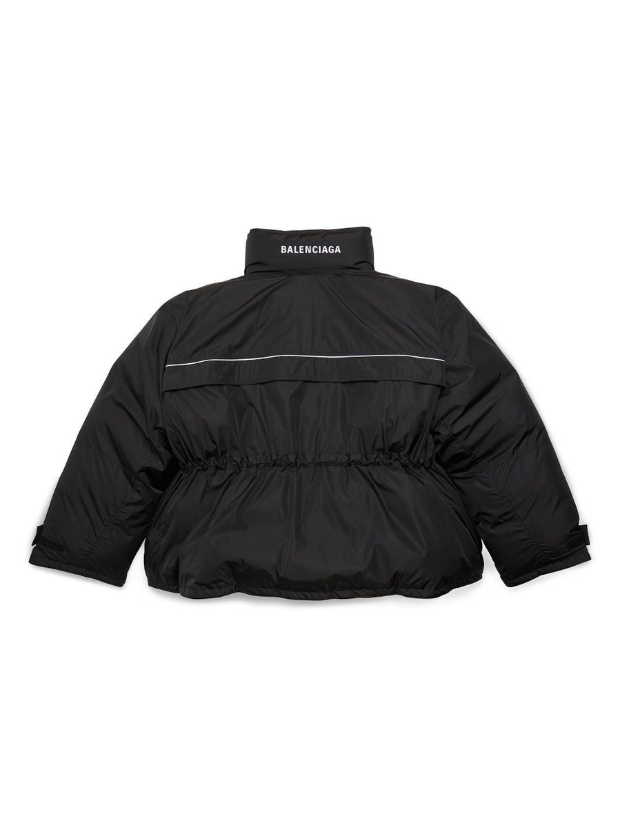 Close-up of Balenciaga outerwear hardware and fine stitching