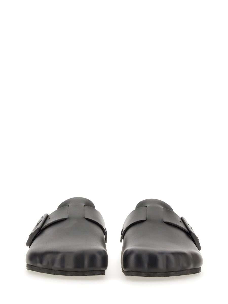 Close-up of Balenciaga sandals hardware and fine stitching