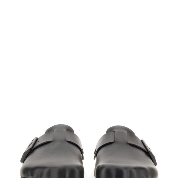 Close-up of Balenciaga sandals hardware and fine stitching