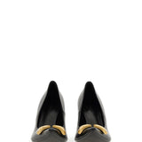 Close-up of Balenciaga pumps hardware and fine stitching