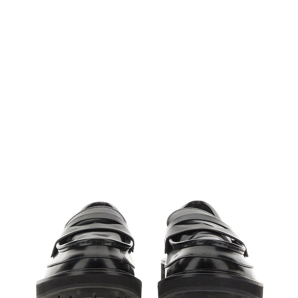 Close-up of Alexander McQueen slides hardware and fine stitching