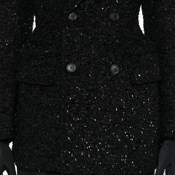 Close-up of Balenciaga outerwear hardware and fine stitching