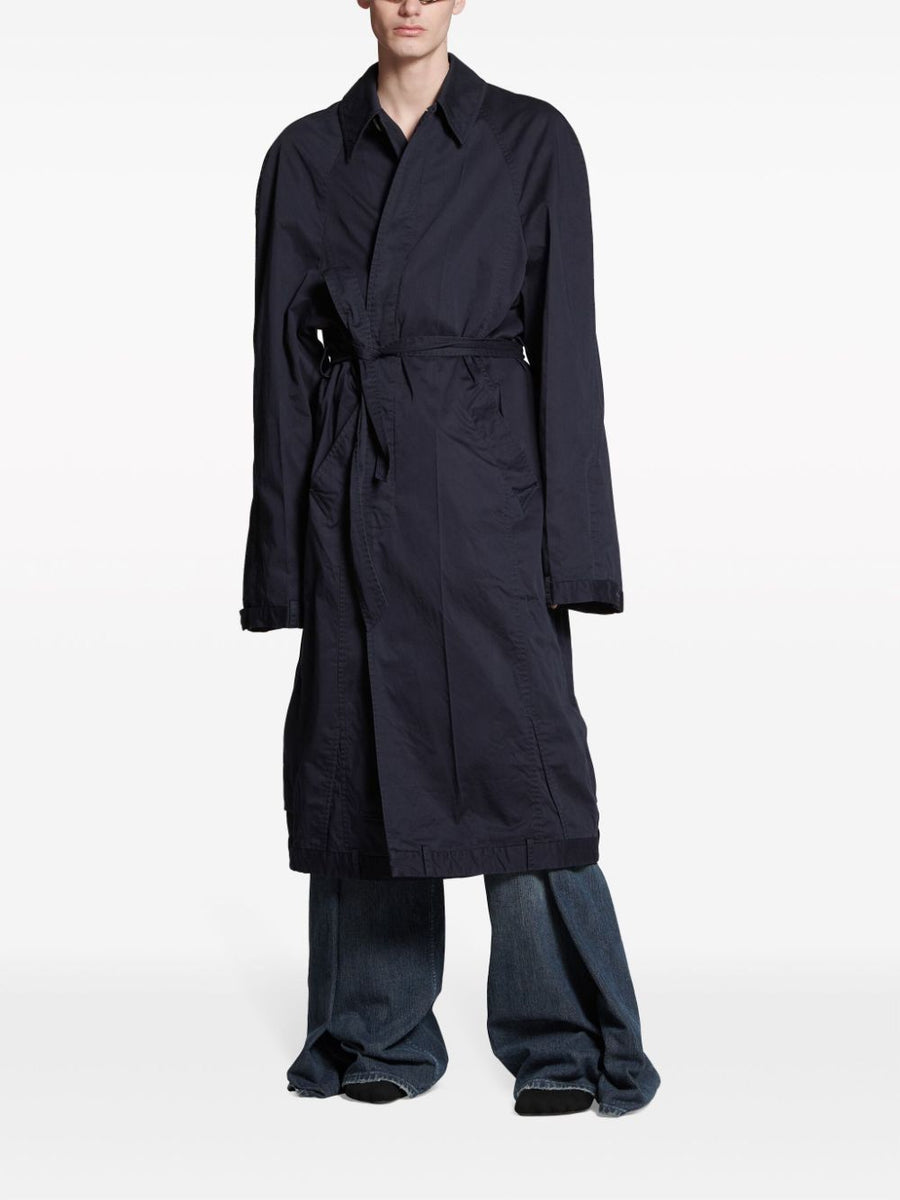 Close-up of Balenciaga outerwear hardware and fine stitching