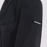 Close-up of Balenciaga outerwear hardware and fine stitching