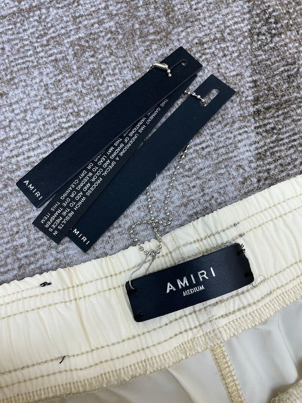 Front view of Amiri luxury piece style No.084