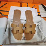 Hermès White Ankle Strap Sandals - Angled View