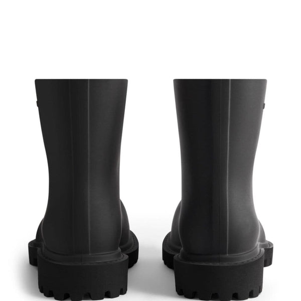Close-up of Balenciaga boots hardware and fine stitching