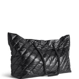 Close-up of Balenciaga totes hardware and fine stitching