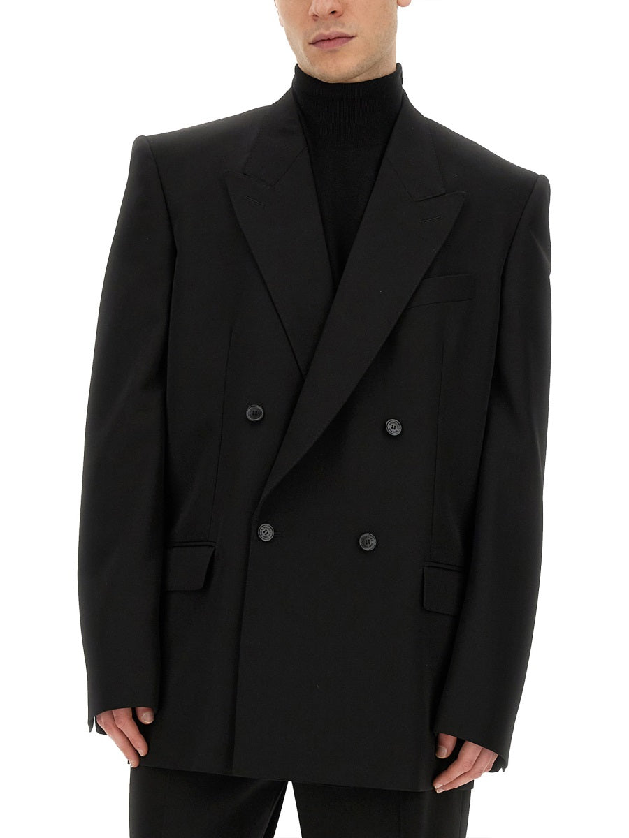 Close-up of Balenciaga outerwear hardware and fine stitching