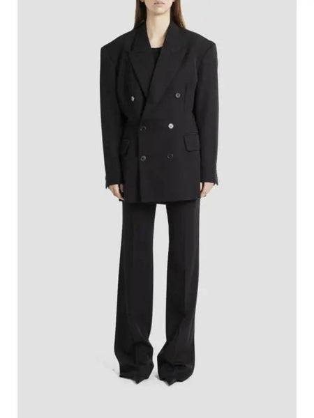 Close-up of Balenciaga pants hardware and fine stitching