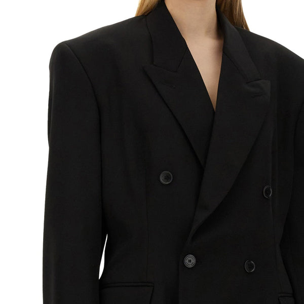 Close-up of Balenciaga outerwear hardware and fine stitching