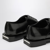 Close-up of Alexander McQueen flats hardware and fine stitching
