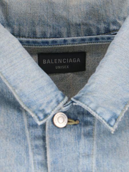 Close-up of Balenciaga outerwear hardware and fine stitching