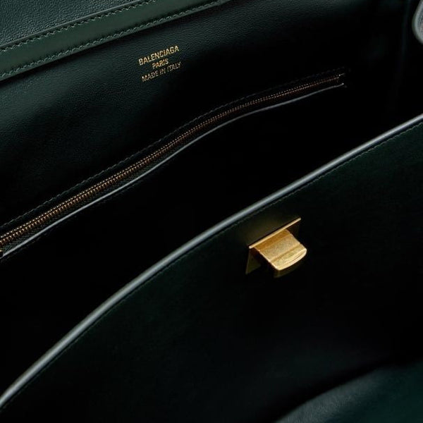 Close-up of Balenciaga handbags hardware and fine stitching