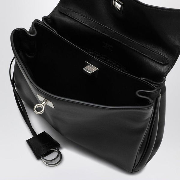Close-up of Balenciaga handbags hardware and fine stitching