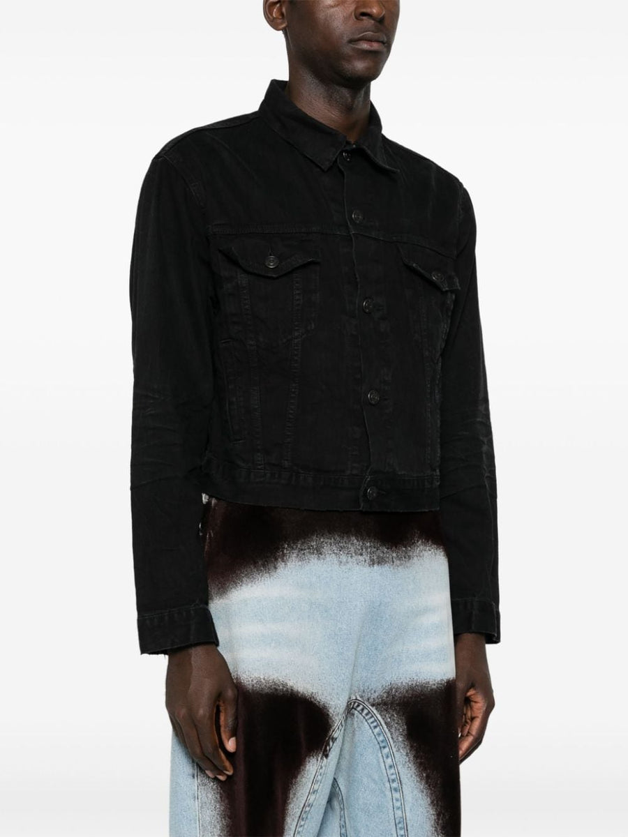 Close-up of Balenciaga outerwear hardware and fine stitching