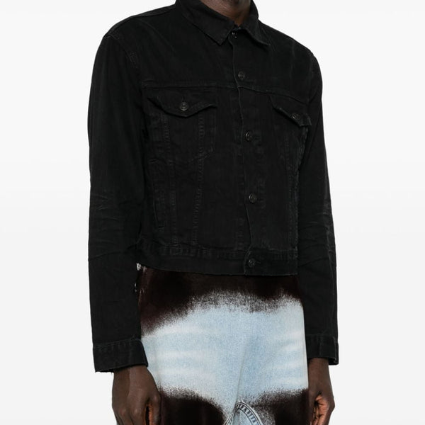 Close-up of Balenciaga outerwear hardware and fine stitching