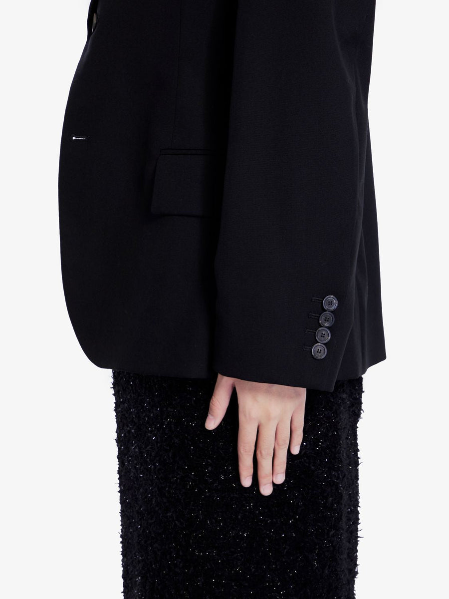 Close-up of Balenciaga outerwear hardware and fine stitching