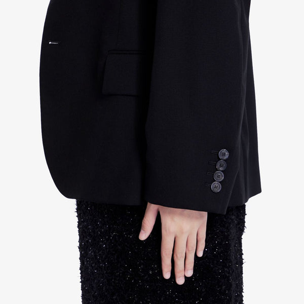 Close-up of Balenciaga outerwear hardware and fine stitching