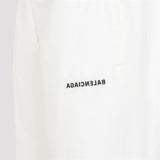 Close-up of Balenciaga pants hardware and fine stitching