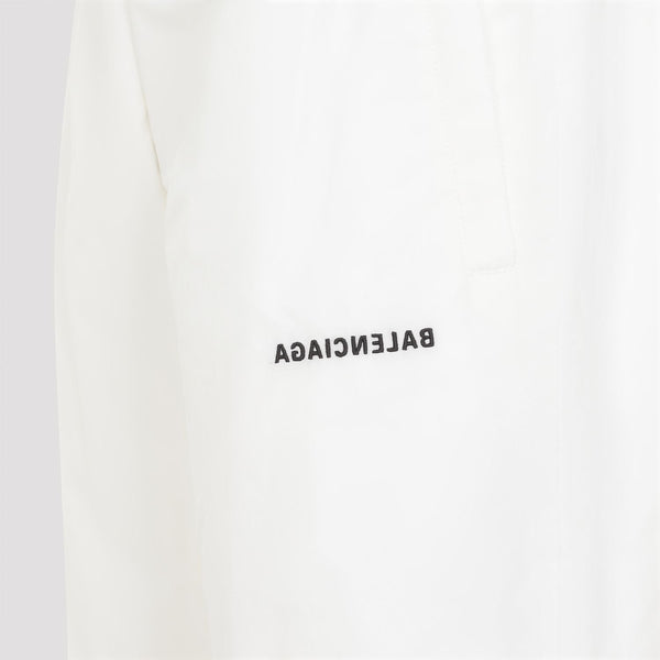 Close-up of Balenciaga pants hardware and fine stitching