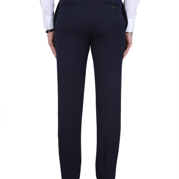 Close-up of Alexander McQueen pants hardware and fine stitching