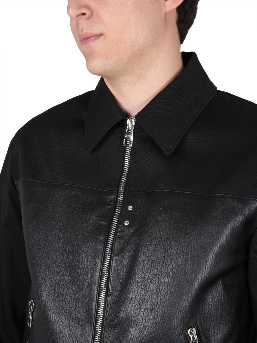 Close-up of Alexander McQueen jackets hardware and fine stitching