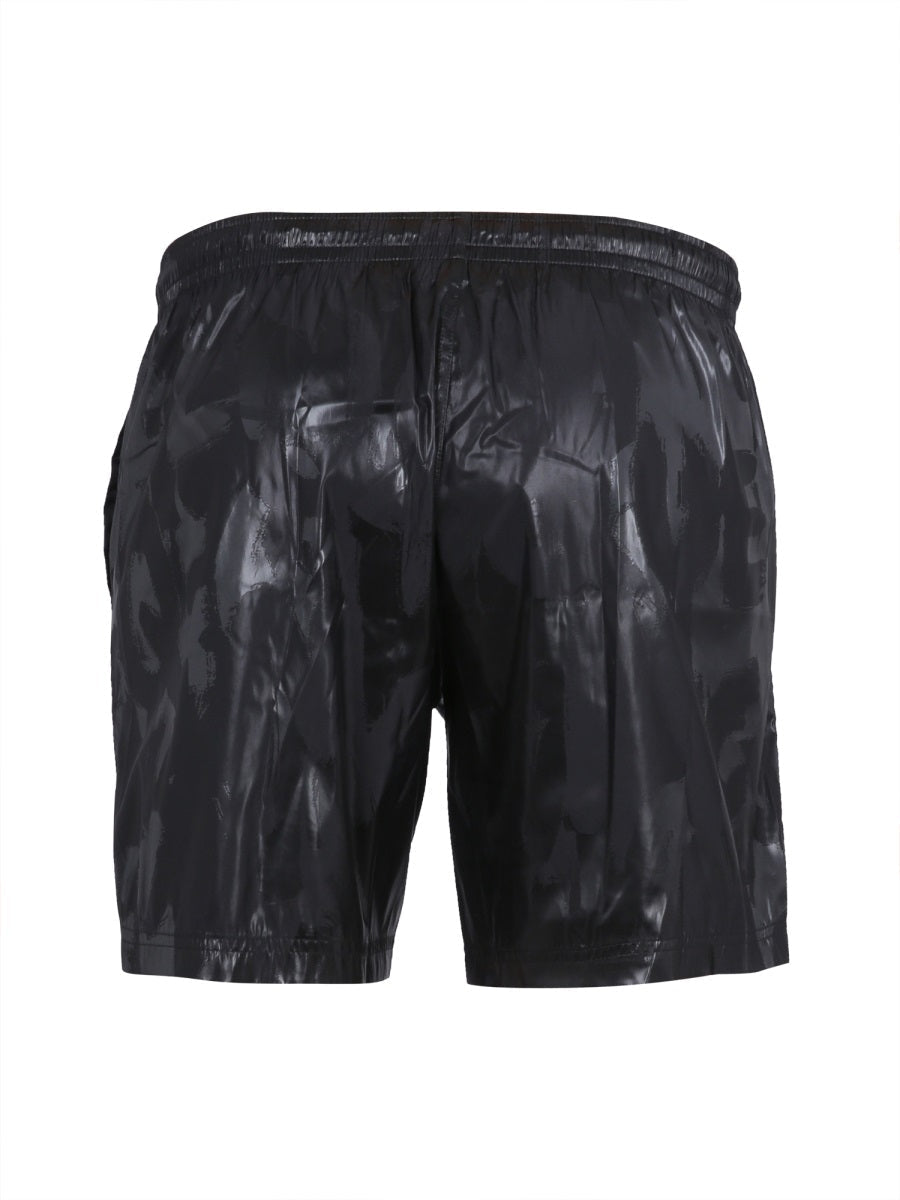 Close-up of Alexander McQueen swimsuits hardware and fine stitching