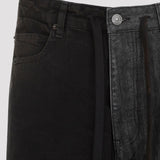 Close-up of Balenciaga pants hardware and fine stitching