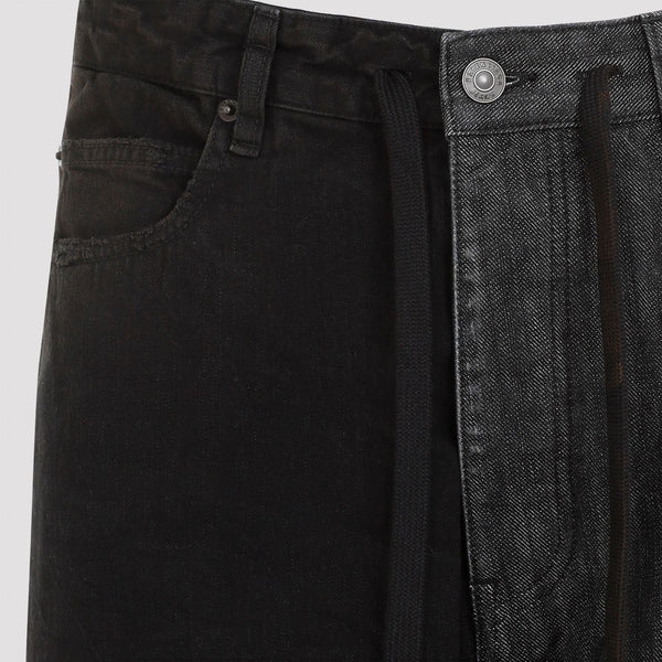 Close-up of Balenciaga pants hardware and fine stitching