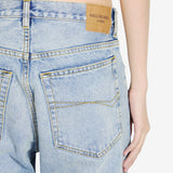 Close-up of Balenciaga pants hardware and fine stitching
