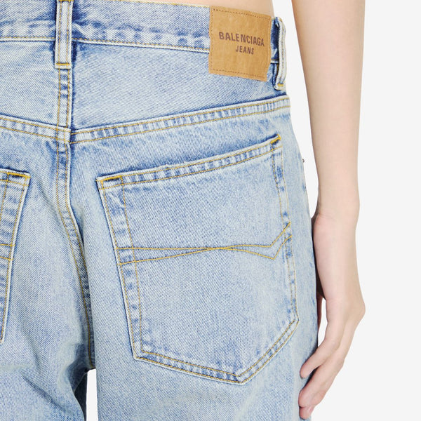 Close-up of Balenciaga pants hardware and fine stitching