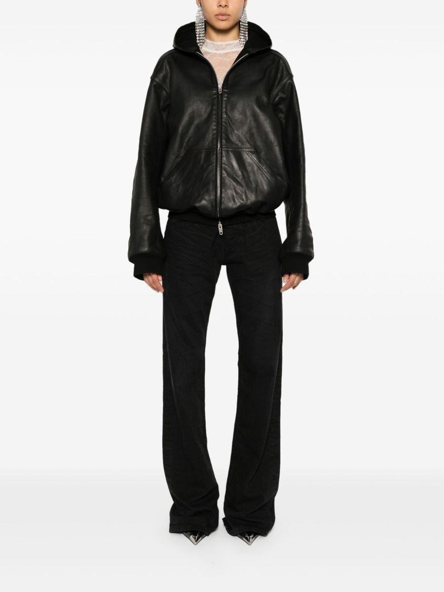 Close-up of Balenciaga pants hardware and fine stitching