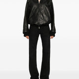 Close-up of Balenciaga pants hardware and fine stitching
