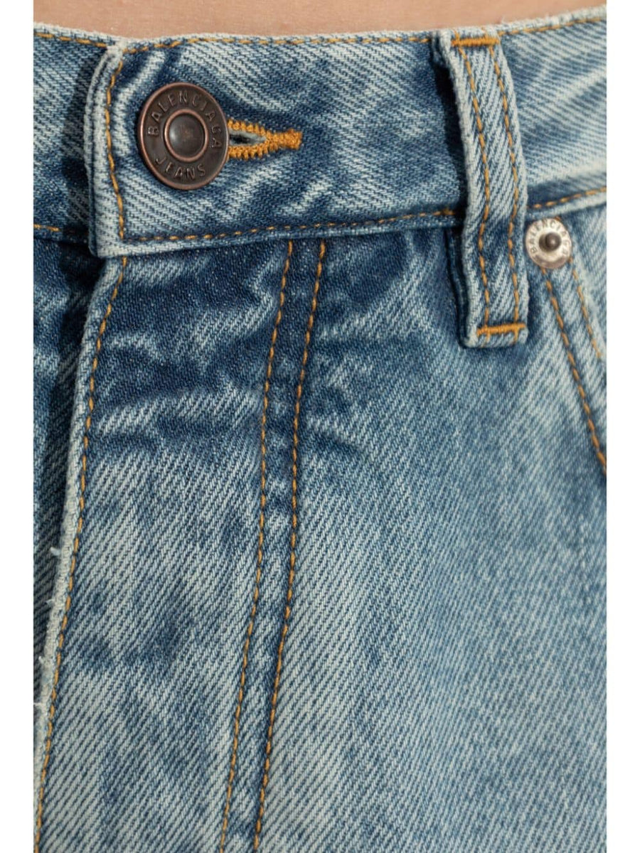 Close-up of Balenciaga pants hardware and fine stitching