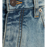 Close-up of Balenciaga pants hardware and fine stitching