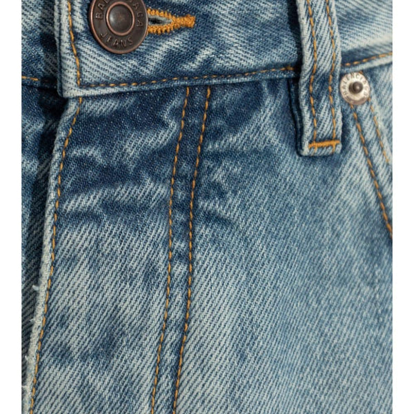 Close-up of Balenciaga pants hardware and fine stitching