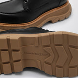 Close-up of Alexander McQueen flats hardware and fine stitching
