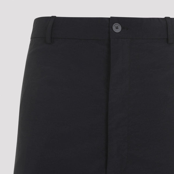 Close-up of Balenciaga pants hardware and fine stitching