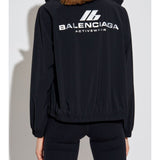 Close-up of Balenciaga outerwear hardware and fine stitching