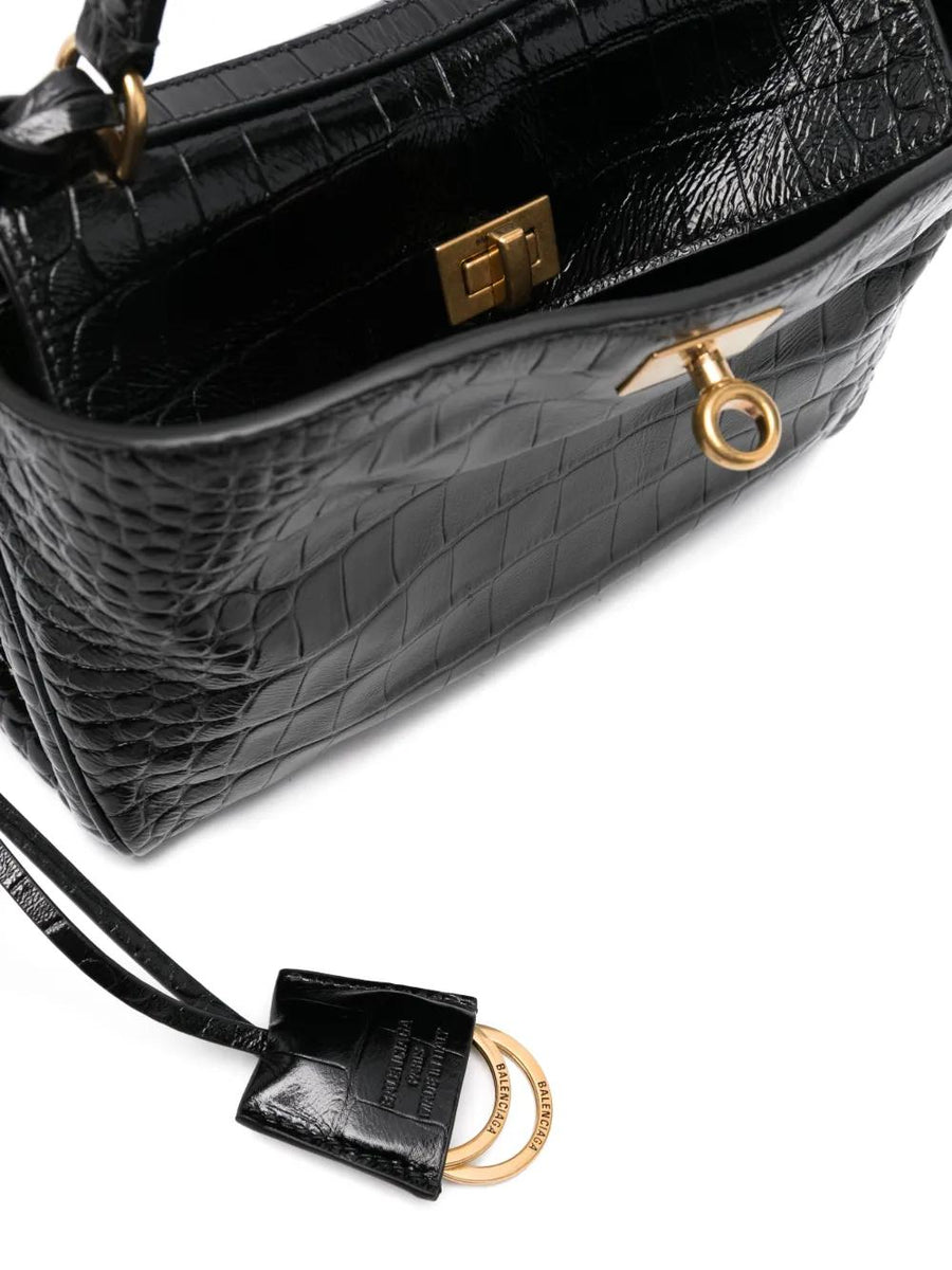 Close-up of Balenciaga handbags hardware and fine stitching