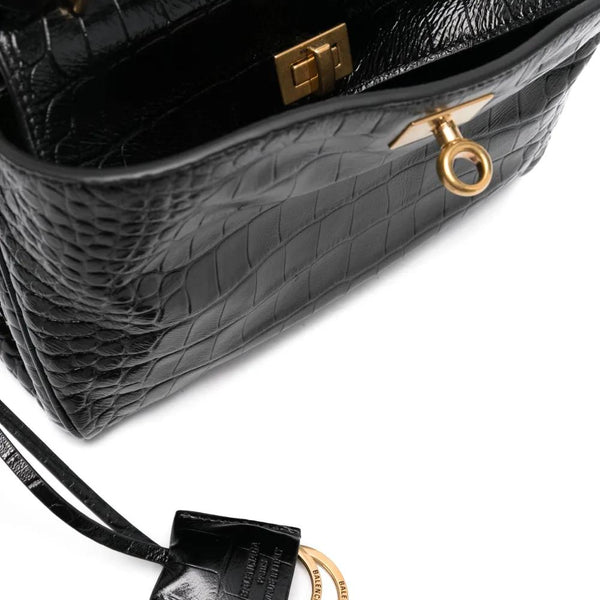 Close-up of Balenciaga handbags hardware and fine stitching